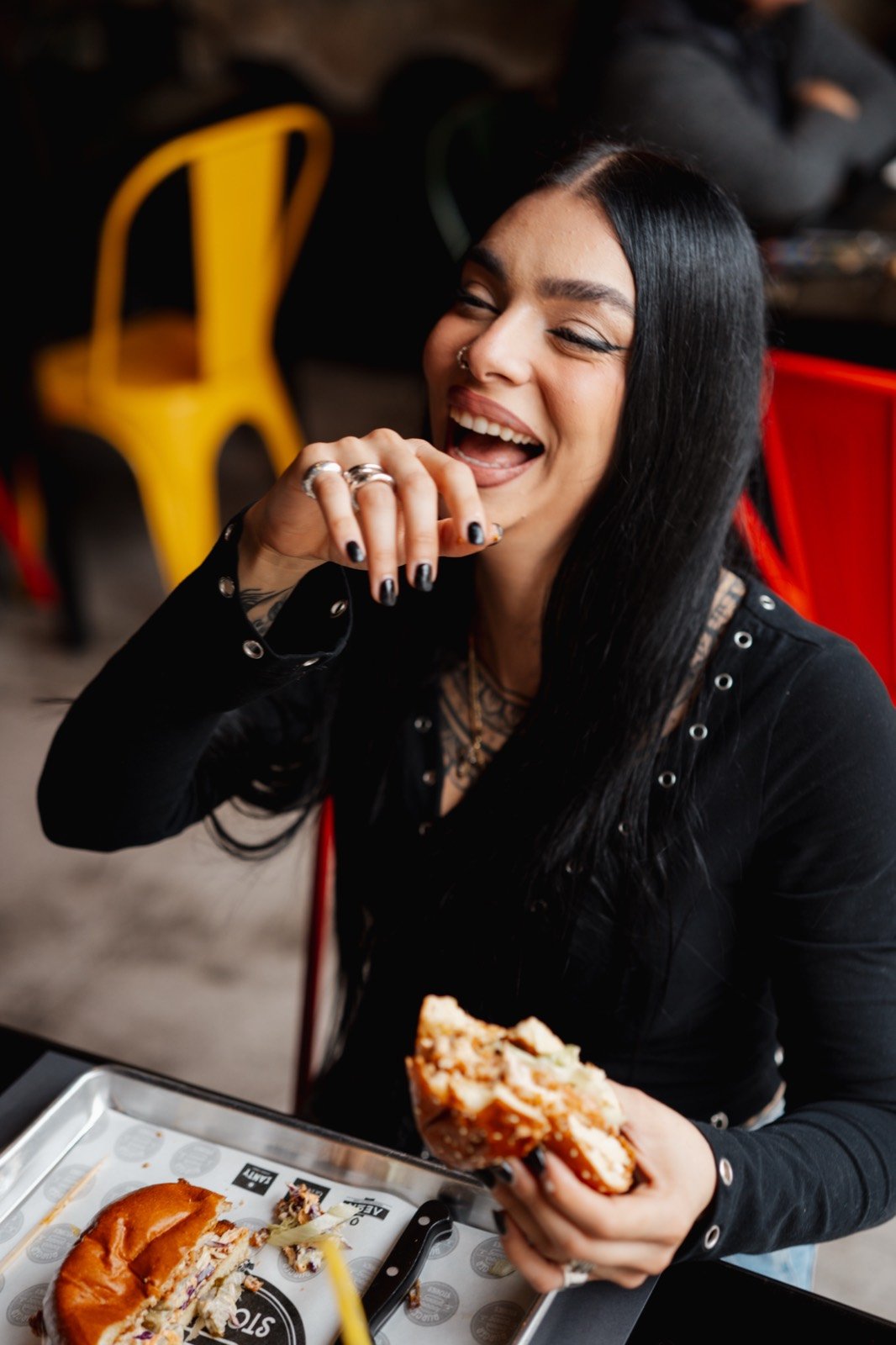 Guest laughing over a burger
